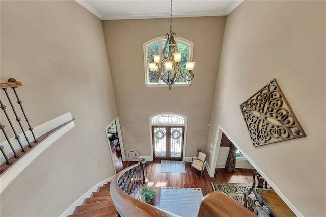 51 Mountain Ridge Dr SE, Cartersville, GA 30120 - entrance foyer featuring a chandelier, stairs, french doors, wood finished floors, and a high ceiling