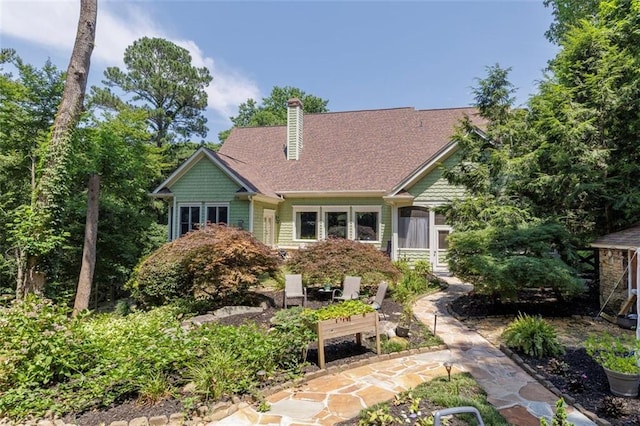 51 Mountain Ridge Dr SE, Cartersville, GA 30120 - view of front of house featuring a chimney and roof with shingles