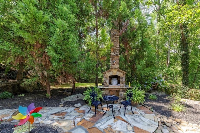 51 Mountain Ridge Dr SE, Cartersville, GA 30120 - view of patio with an outdoor stone fireplace