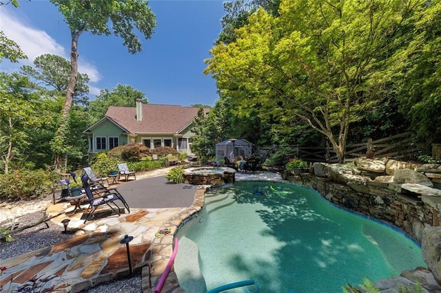 51 Mountain Ridge Dr SE, Cartersville, GA 30120 - view of pool with a storage unit, a patio, and a pool with connected hot tub