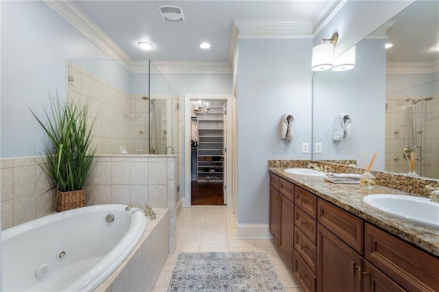 bathroom featuring vanity, ornamental molding, tile patterned floors, and shower with separate bathtub