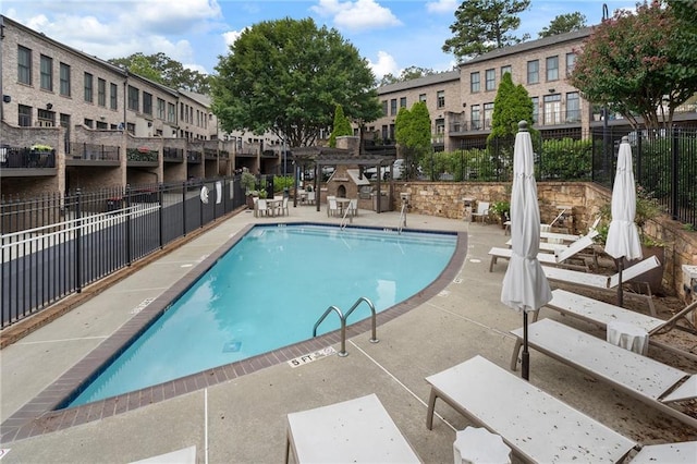 view of swimming pool with a patio area