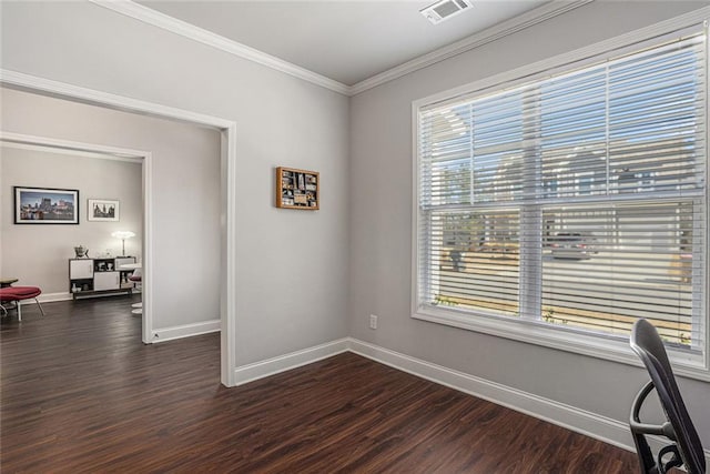 office space with crown molding, dark wood-style flooring, visible vents, and plenty of natural light