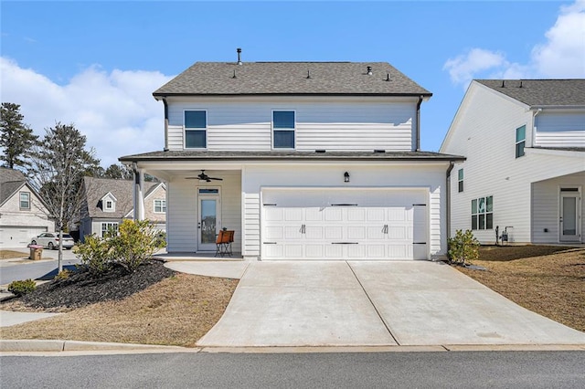 view of front of property with a garage, concrete driveway, and a shingled roof