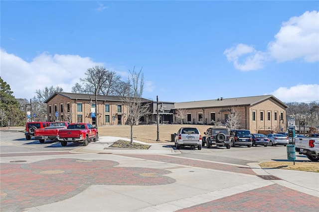 view of property with uncovered parking