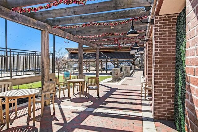 view of patio featuring fence