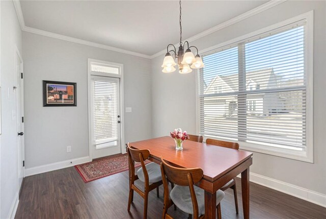 dining area featuring baseboards, ornamental molding, dark wood finished floors, and a chandelier