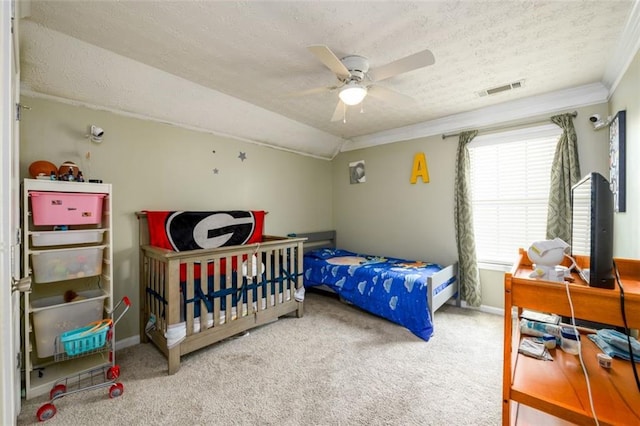 carpeted bedroom with visible vents, a textured ceiling, crown molding, baseboards, and vaulted ceiling