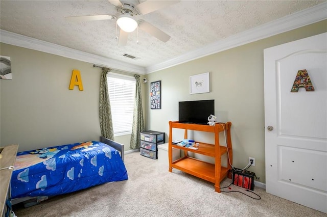 carpeted bedroom featuring visible vents, a textured ceiling, ornamental molding, and a ceiling fan