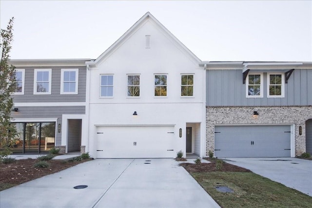 view of front of home featuring a garage, driveway, and board and batten siding