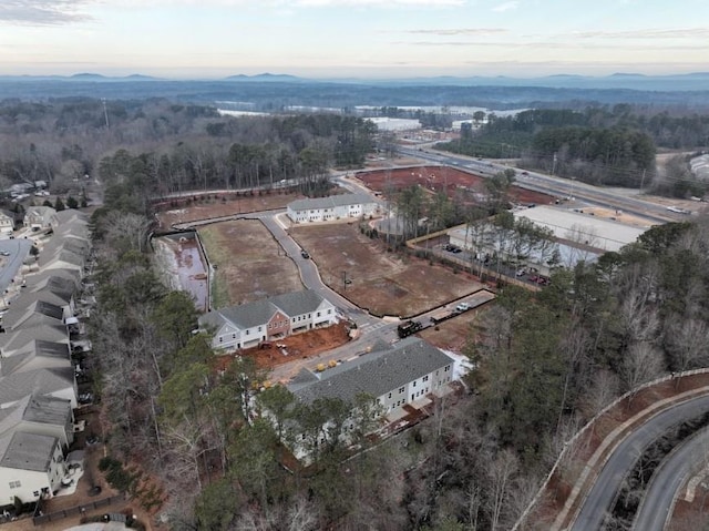 birds eye view of property with a wooded view