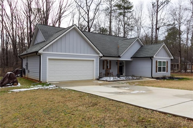 view of front of home featuring a garage and a front lawn