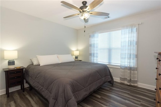 bedroom featuring dark wood-type flooring and ceiling fan