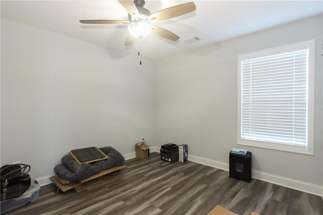 miscellaneous room with dark wood-type flooring and ceiling fan