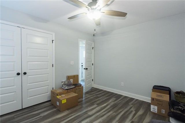 miscellaneous room featuring ceiling fan and dark hardwood / wood-style flooring