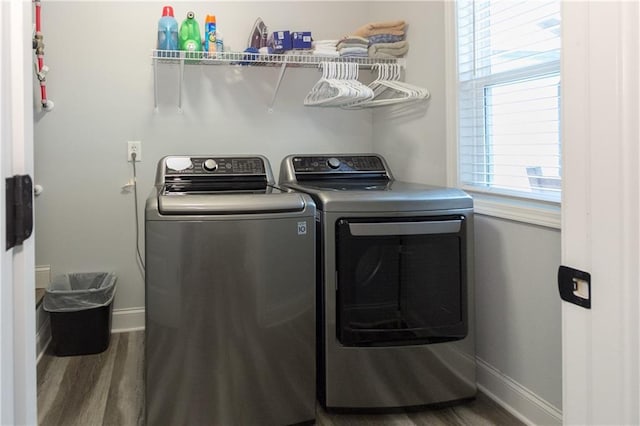 laundry area with hardwood / wood-style flooring and washer and clothes dryer