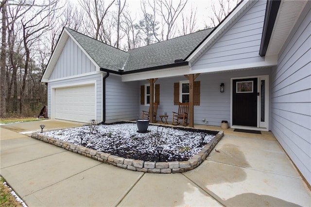 view of front of house with a garage and covered porch