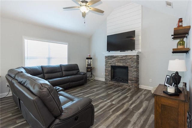 living room with dark hardwood / wood-style floors, ceiling fan, lofted ceiling, and a stone fireplace