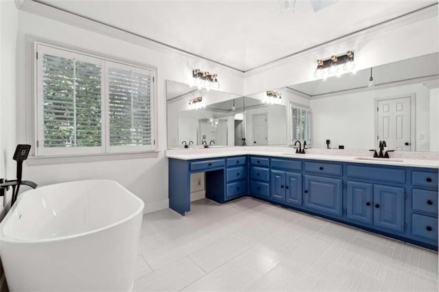 bathroom featuring a bath, vanity, and crown molding