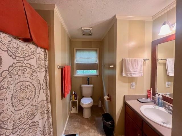 bathroom with a textured ceiling, crown molding, vanity, baseboards, and toilet