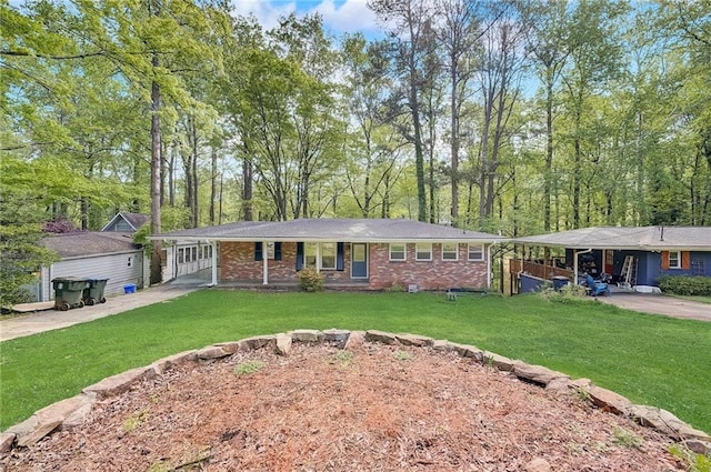 ranch-style house featuring a carport and a front lawn