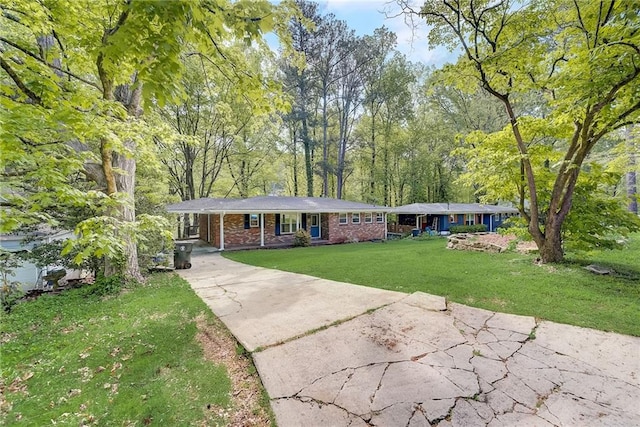 ranch-style home featuring a front yard