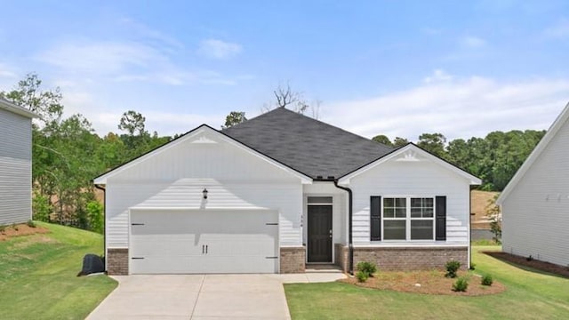 ranch-style home featuring an attached garage, a front lawn, and brick siding