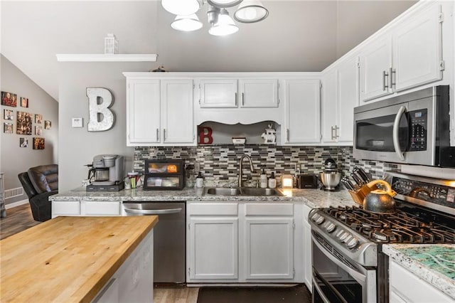 238 Brentwood Dr, Dallas, GA 30132 - kitchen featuring white cabinets, stainless steel appliances, light stone counters, and sink