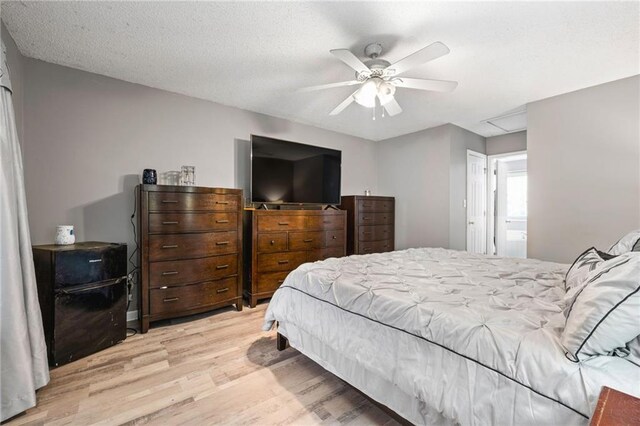 238 Brentwood Dr, Dallas, GA 30132 - bedroom with ceiling fan, light hardwood / wood-style floors, and a textured ceiling