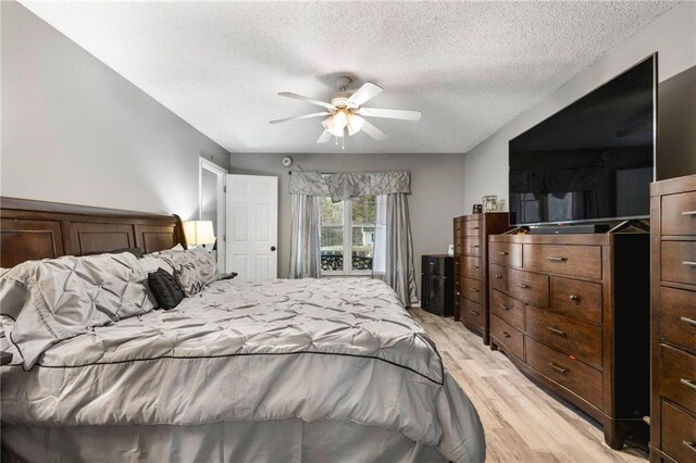 238 Brentwood Dr, Dallas, GA 30132 - bedroom featuring ceiling fan, light hardwood / wood-style floors, and a textured ceiling