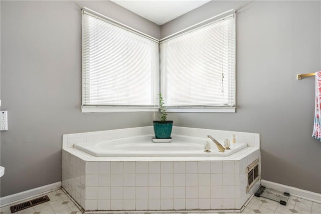 238 Brentwood Dr, Dallas, GA 30132 - bathroom with tile patterned flooring and tiled bath