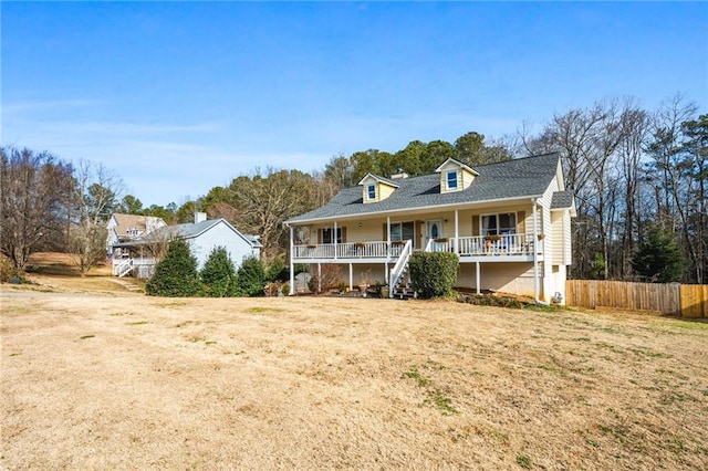 view of front facade featuring a front lawn and covered porch