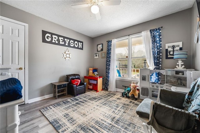 238 Brentwood Dr, Dallas, GA 30132 - living area featuring hardwood / wood-style floors, a textured ceiling, and ceiling fan