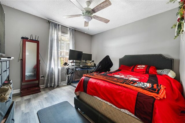 238 Brentwood Dr, Dallas, GA 30132 - bedroom with ceiling fan, a textured ceiling, and light hardwood / wood-style flooring
