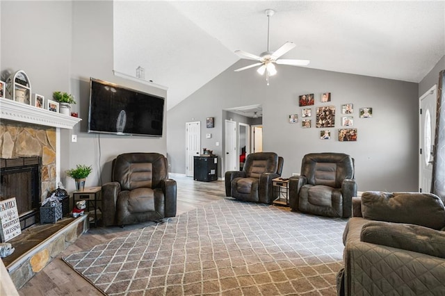 238 Brentwood Dr, Dallas, GA 30132 - living room with hardwood / wood-style flooring, ceiling fan, a stone fireplace, and lofted ceiling
