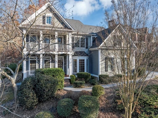 view of front of house featuring a balcony