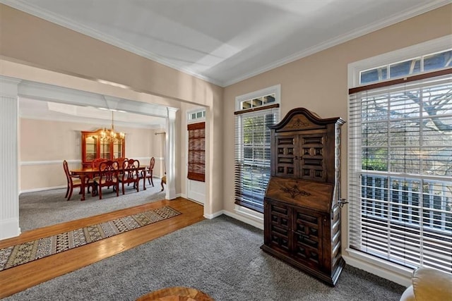 interior space featuring crown molding, plenty of natural light, wood-type flooring, and an inviting chandelier