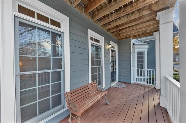 wooden deck featuring covered porch