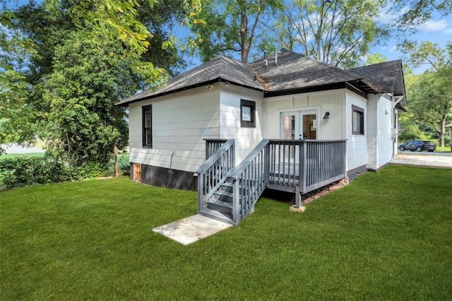 rear view of property with a yard and french doors