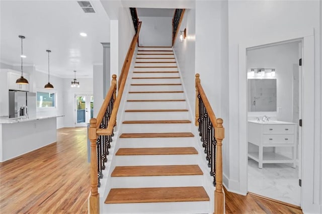 stairs with wood-type flooring