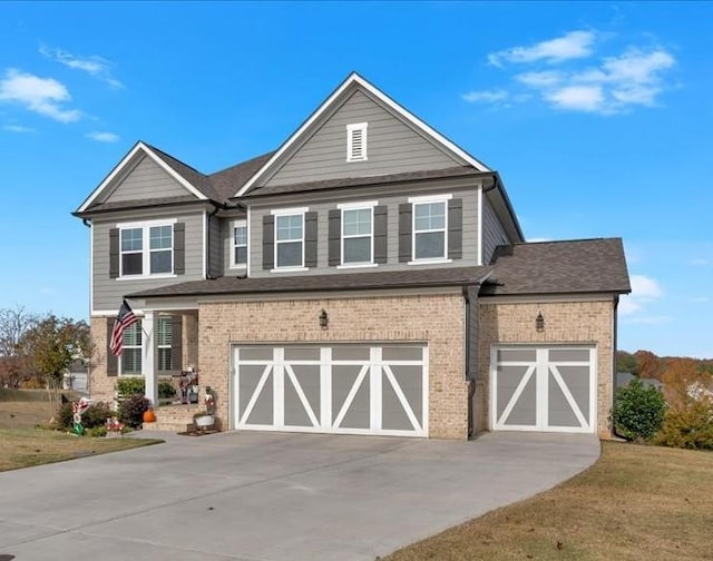 view of front of house featuring concrete driveway, an attached garage, brick siding, and a front yard