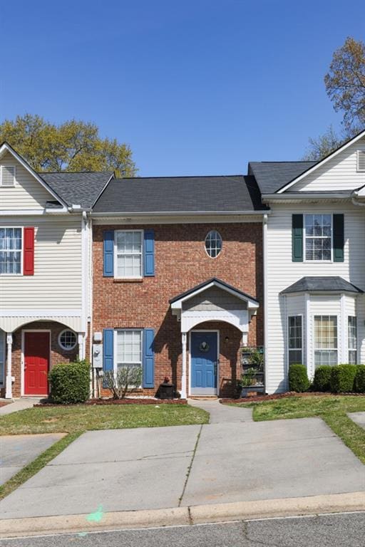 view of property featuring brick siding