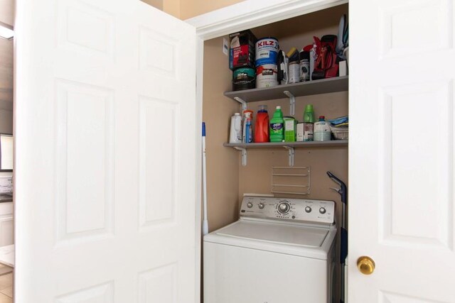 laundry room with laundry area and washer / dryer