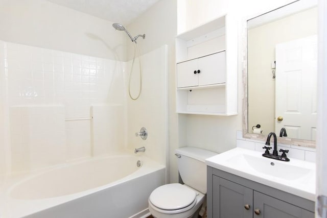 bathroom featuring vanity, toilet, and  shower combination