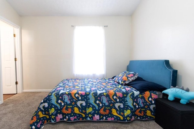 carpeted bedroom with baseboards