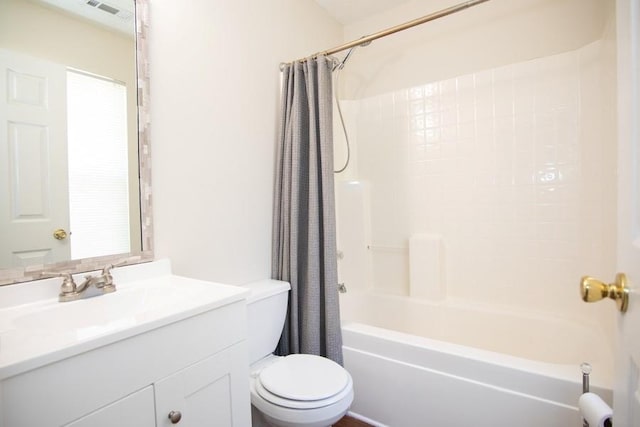 full bath with vanity, shower / tub combo, toilet, and visible vents