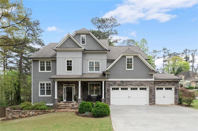 2811 Shady Valley Dr NE, Brookhaven, GA 30324 - craftsman house with a front lawn, stone siding, a garage, board and batten siding, and concrete driveway