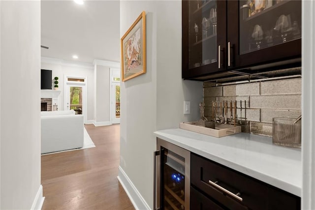 2811 Shady Valley Dr NE, Brookhaven, GA 30324 - dining area featuring dark wood-style flooring, a decorative wall, a chandelier, and wainscoting