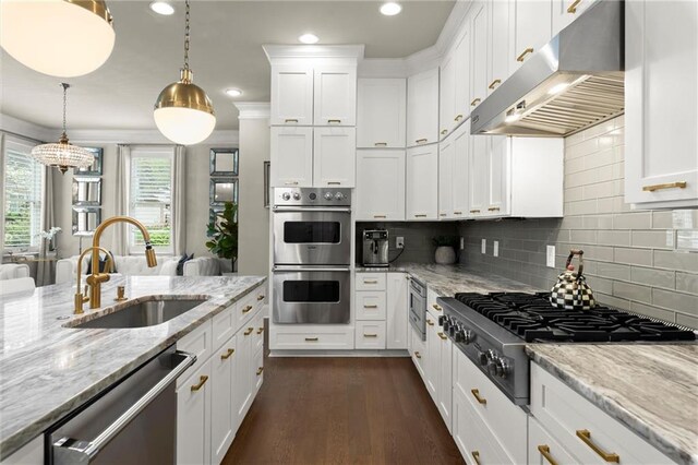 2811 Shady Valley Dr NE, Brookhaven, GA 30324 - kitchen with backsplash, under cabinet range hood, appliances with stainless steel finishes, and ornamental molding