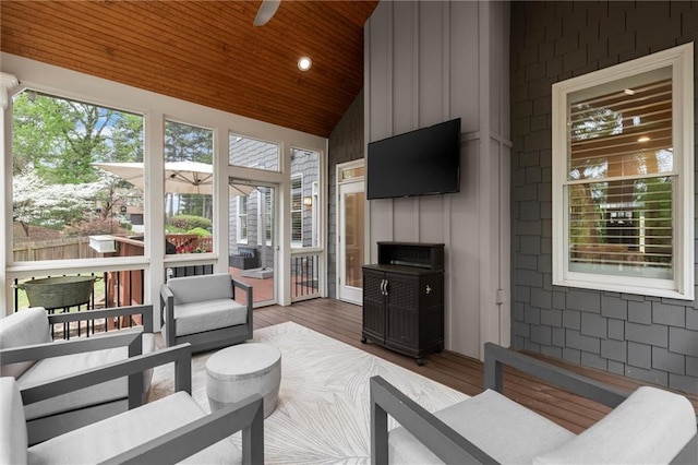 2811 Shady Valley Dr NE, Brookhaven, GA 30324 - living room featuring a stone fireplace, a ceiling fan, and crown molding
